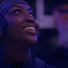 Flau'jae Johnson bears a huge smile as she looks upwards.